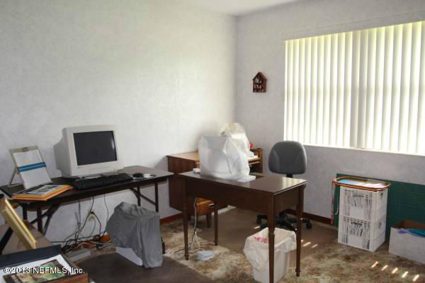 8948 San Rae Road Jacksonville, FL 32257 - Photo 7 of 15 a view of a workspace with furniture and a window
