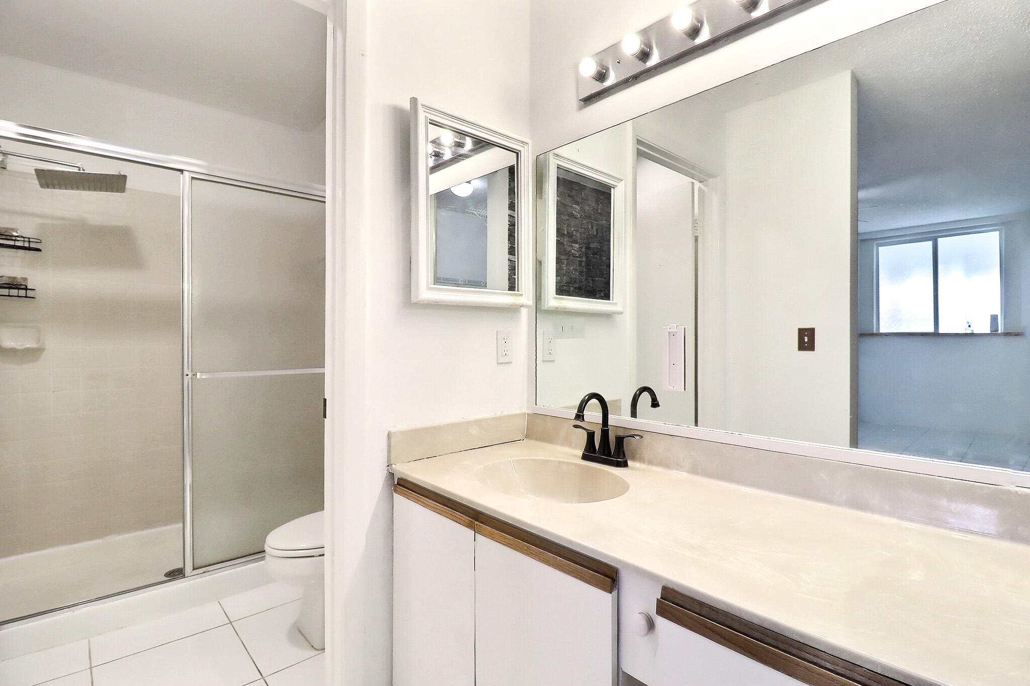 8577 Boca Glades Boulevard West, Unit D Boca Raton, FL 33434 - Photo 16 of 45 Primary Bathroom