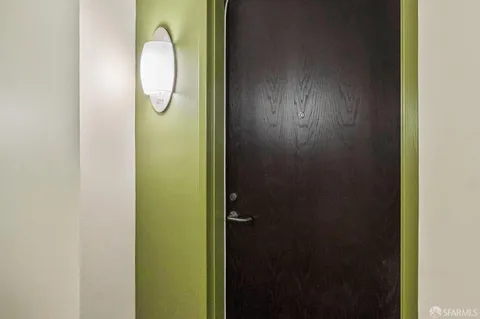 a bathroom with a mirror and vanity