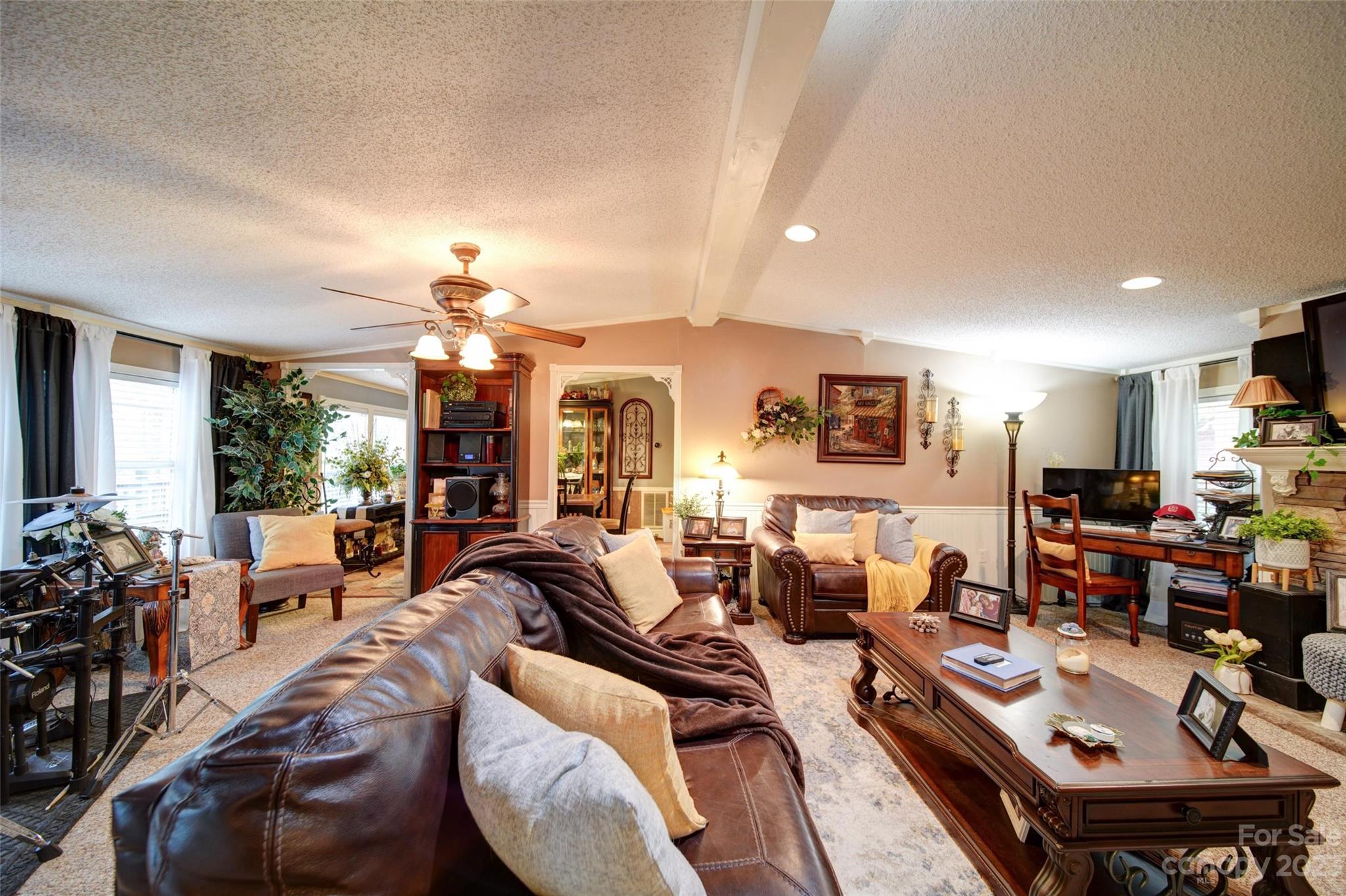 86 Edwards Store Road Peachland, NC 28133 - Photo 11 of 20 a living room with lots of furniture and a chandelier