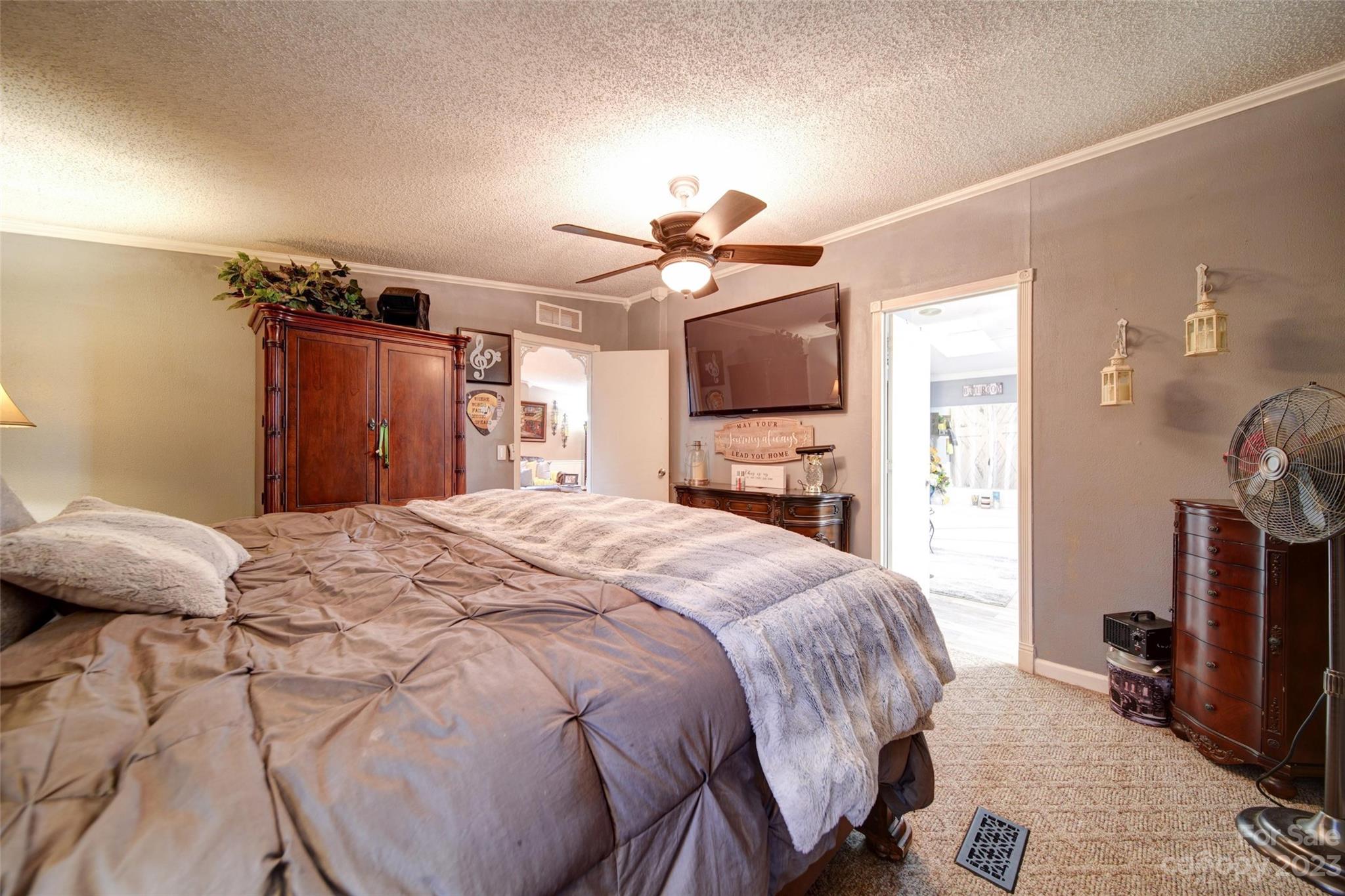 86 Edwards Store Road Peachland, NC 28133 - Photo 12 of 20 a bedroom with a bed and a flat tv screen on dresser