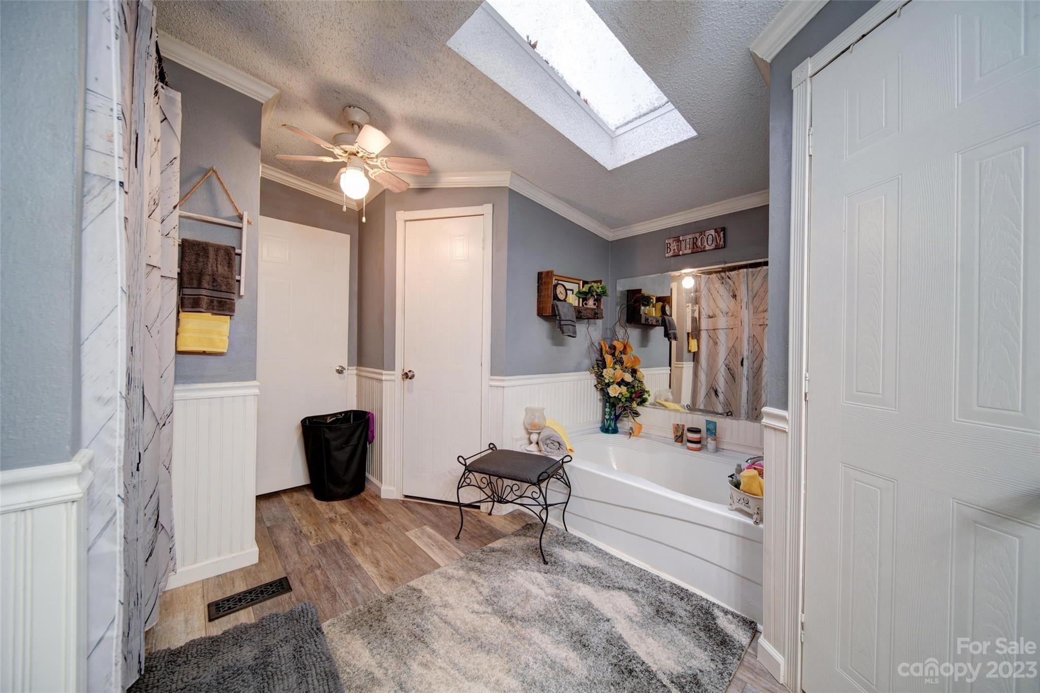 86 Edwards Store Road Peachland, NC 28133 - Photo 13 of 20 a bathroom with a tub shower and a mirror