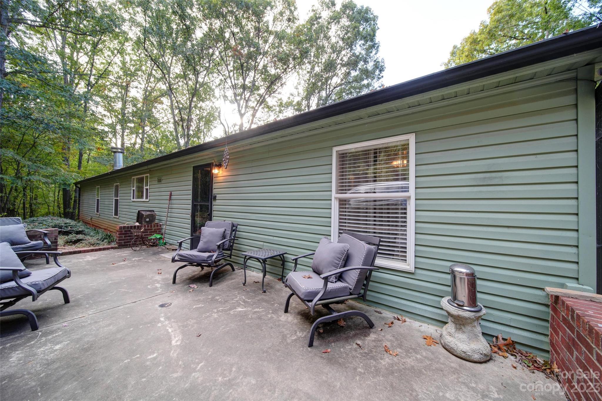 86 Edwards Store Road Peachland, NC 28133 - Photo 19 of 20 a backyard of a house with outdoor seating