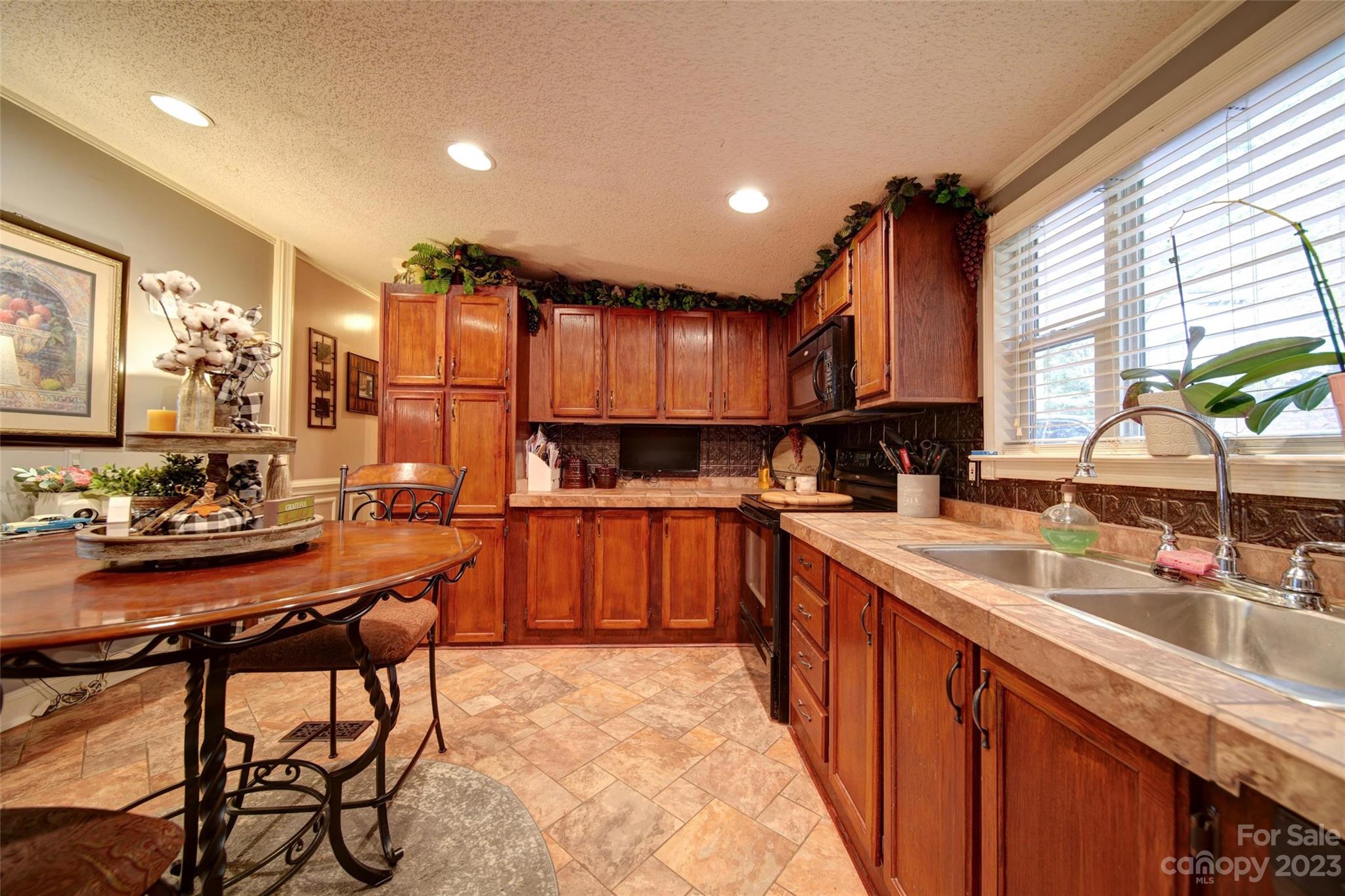 86 Edwards Store Road Peachland, NC 28133 - Photo 4 of 20 a kitchen with stainless steel appliances kitchen island granite countertop a sink and cabinets