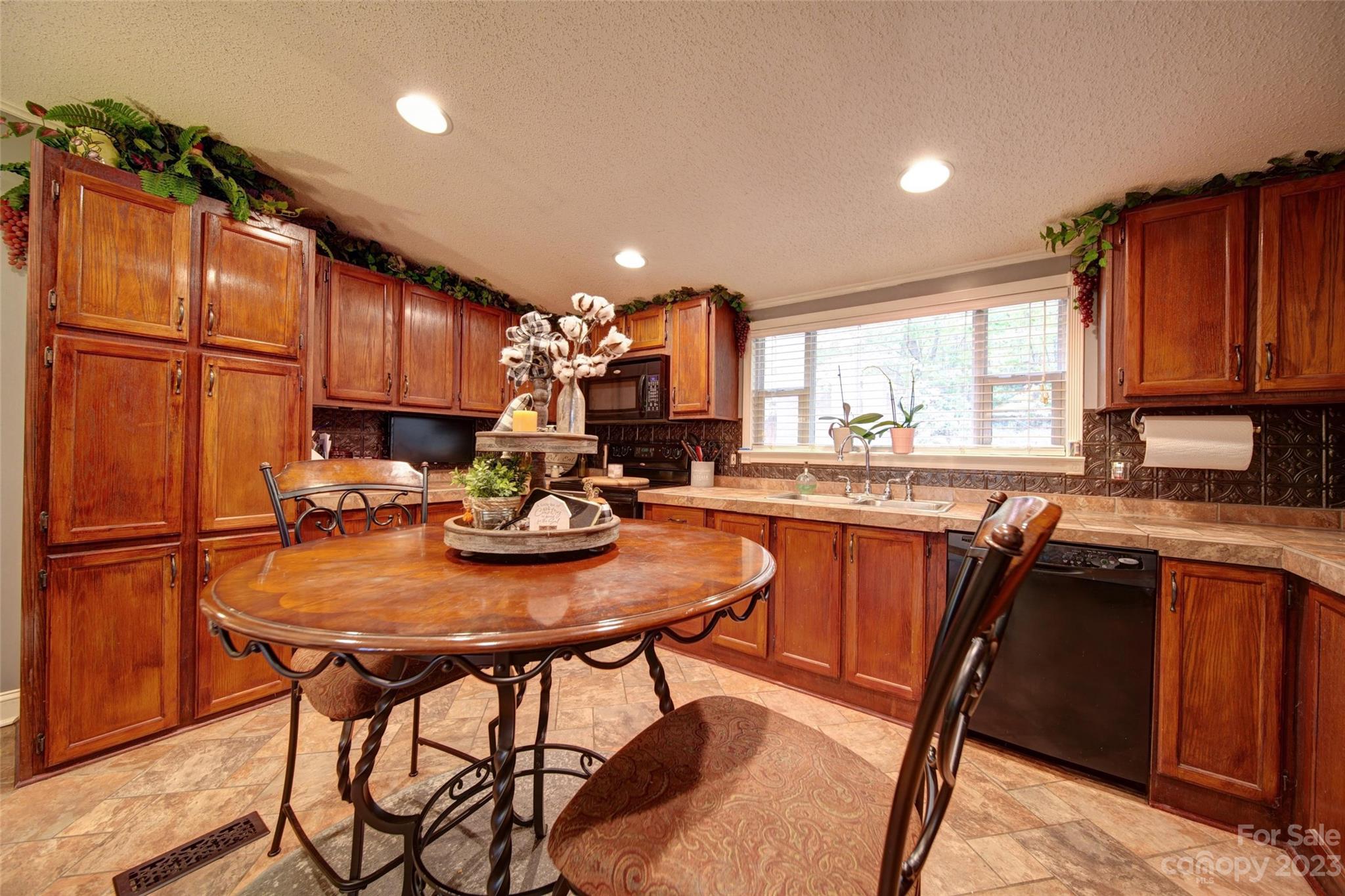 86 Edwards Store Road Peachland, NC 28133 - Photo 5 of 20 a kitchen with a sink cabinets and window