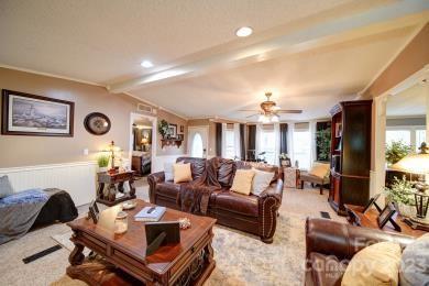 86 Edwards Store Road Peachland, NC 28133 - Photo 8 of 20 a living room with furniture and a chandelier