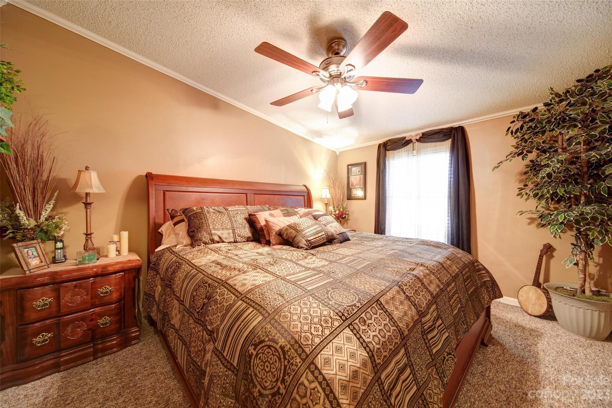 86 Edwards Store Road Peachland, NC 28133 - Photo 9 of 20 a bedroom with a bed and ceiling fan