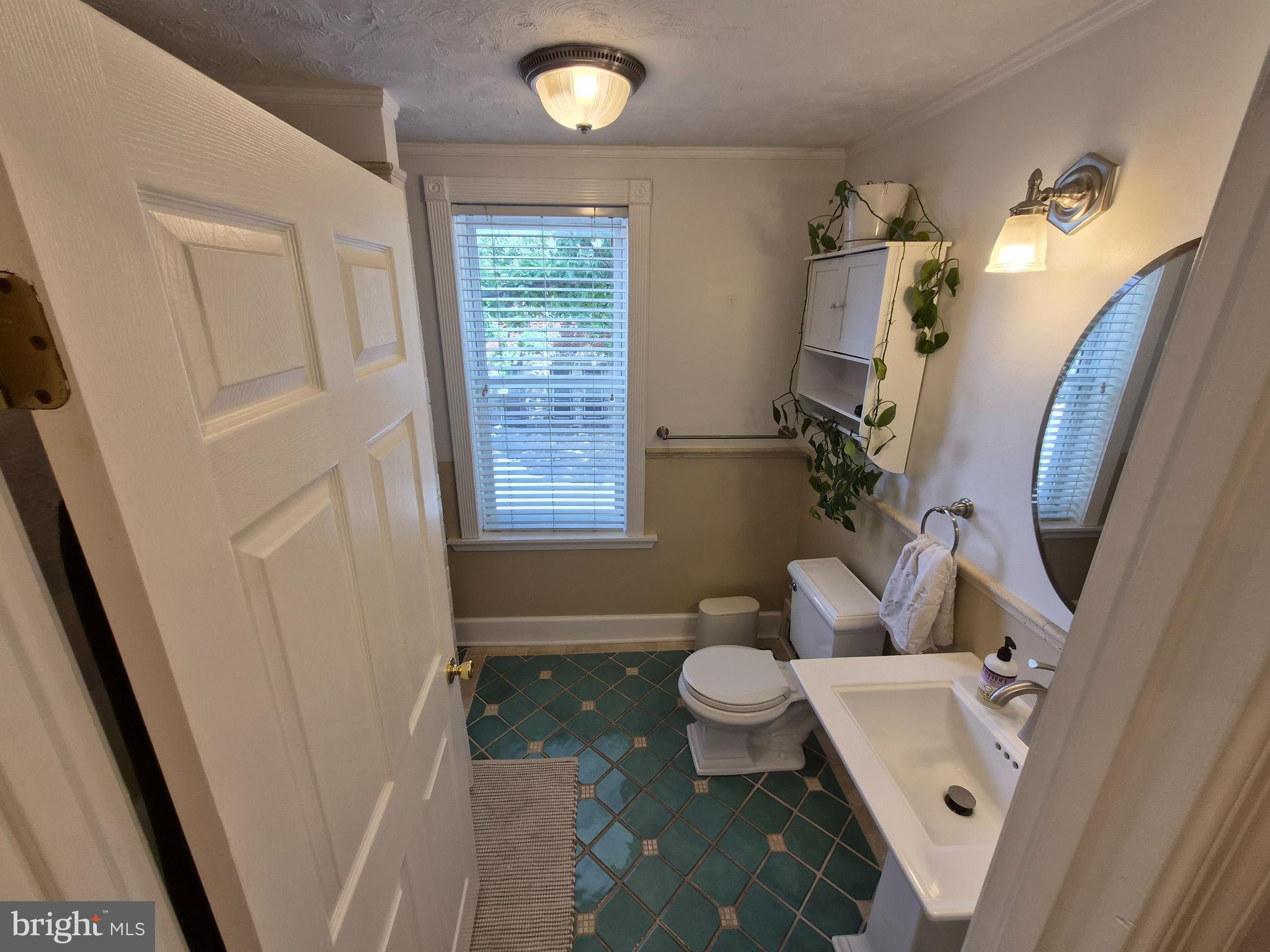 1601 Belt Street Baltimore, MD 21230 - Photo 16 of 30 a bathroom with sink toilet and shower