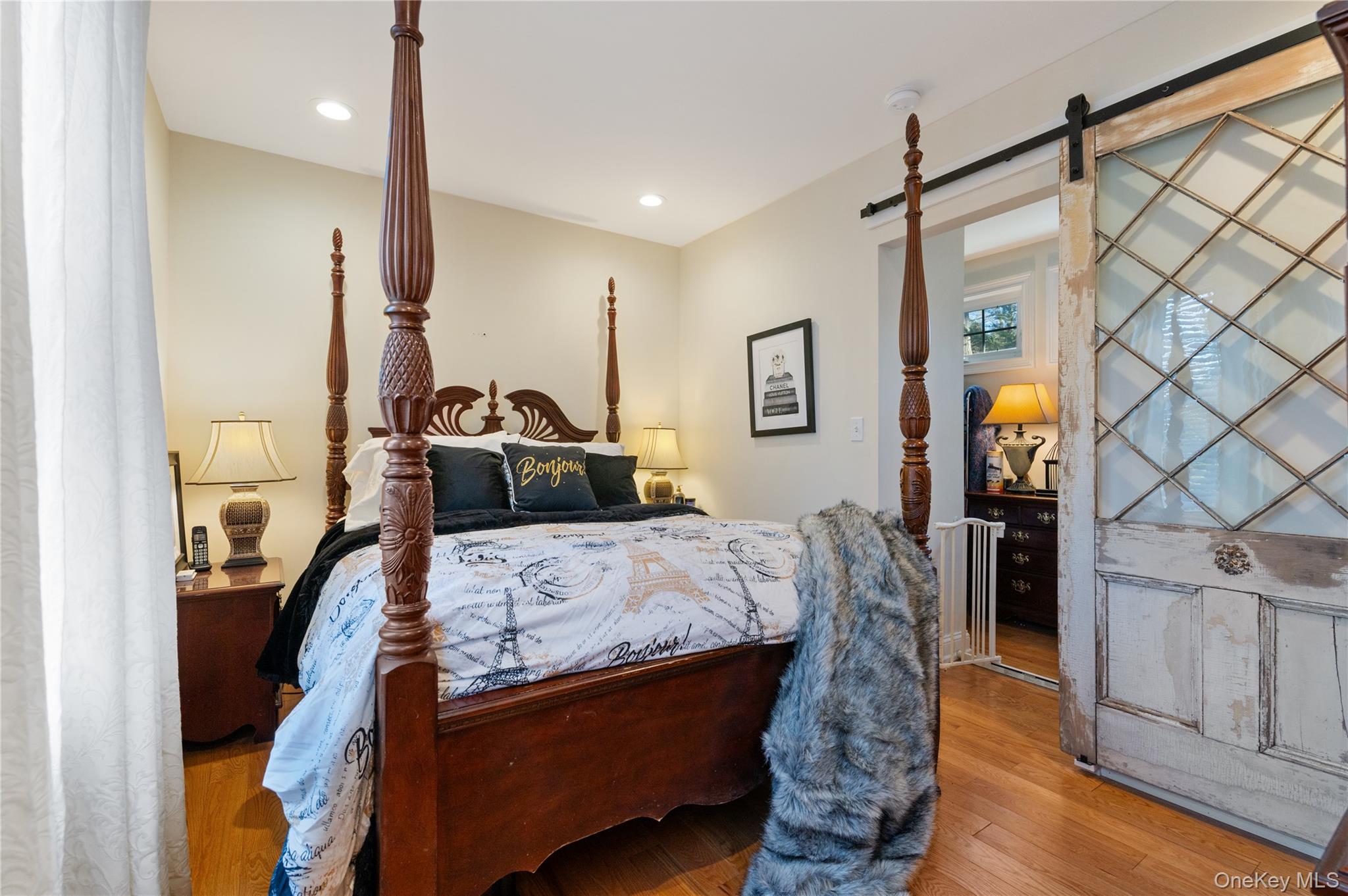 136 Beach Road Wading River, NY 11792 - Photo 20 of 45 Primary bedroom with walk-in-closet barn doors. Laundry in mudroom, access to side door and utility closet.