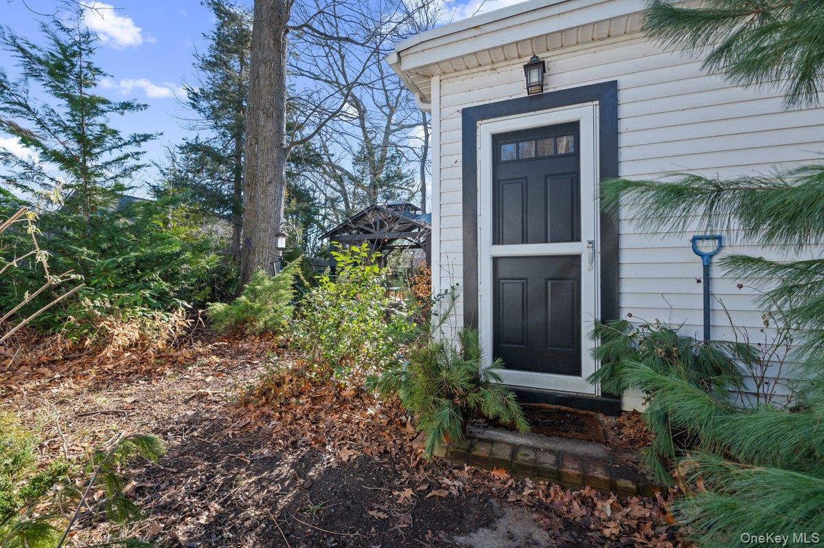 136 Beach Road Wading River, NY 11792 - Photo 5 of 45 Assess to Primary mudroom on side of house.