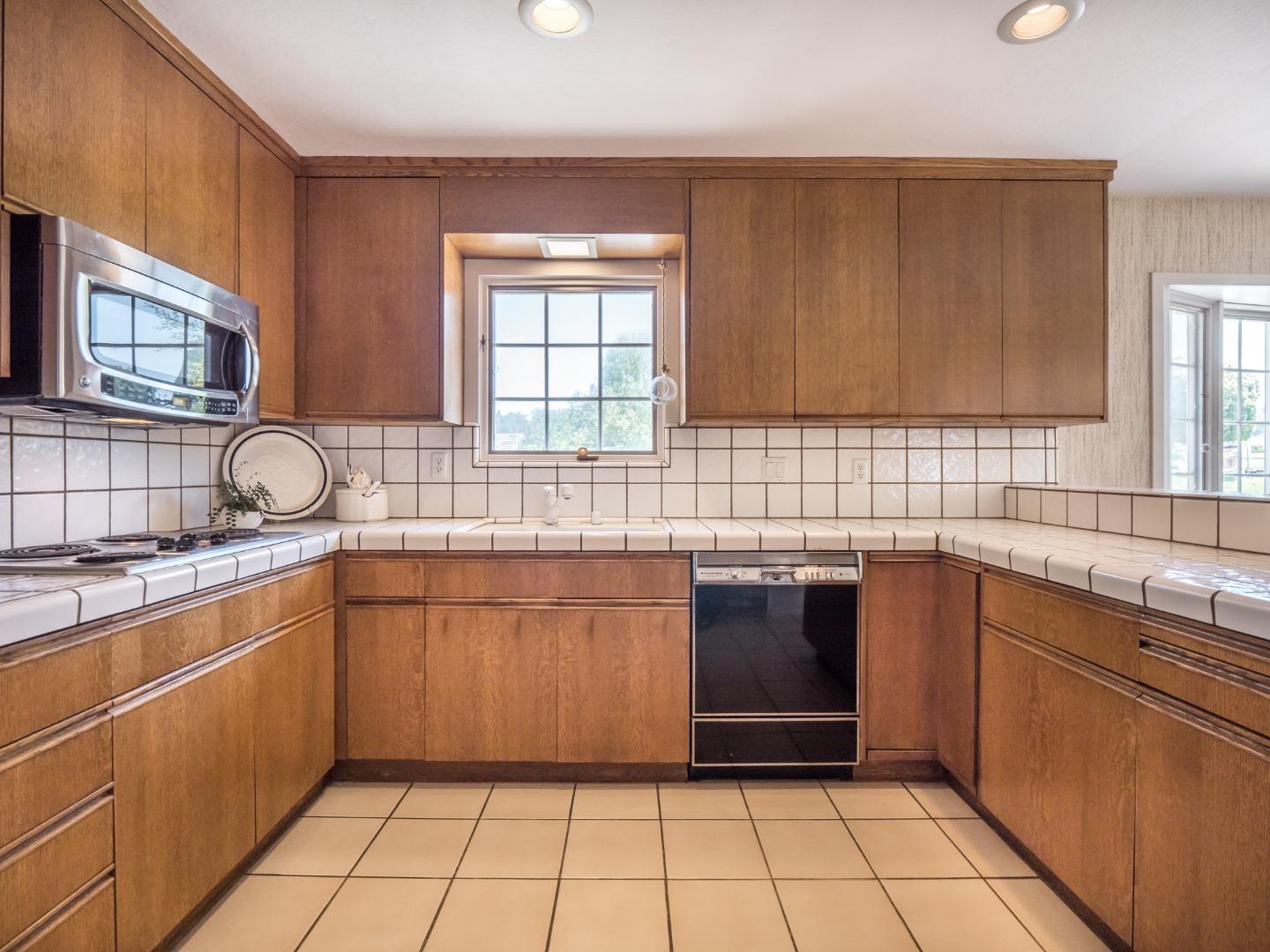 210 Greenbrier Drive Aptos, CA 95003 - Photo 19 of 63 a kitchen with a sink stove and cabinets