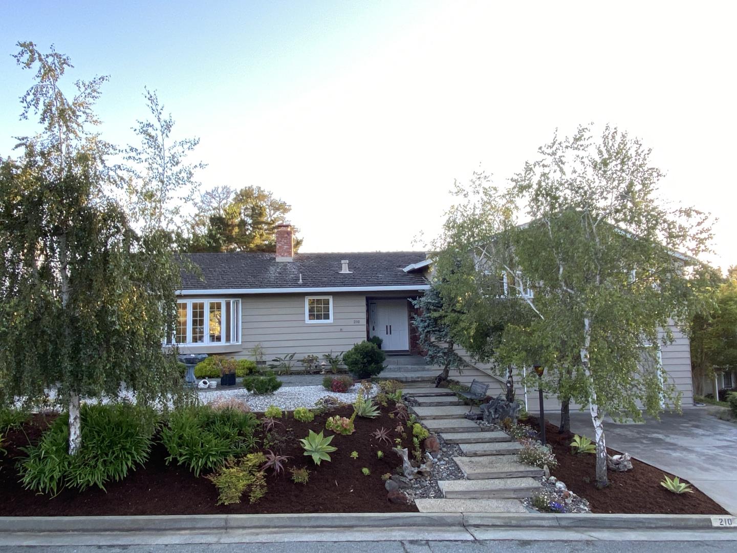 210 Greenbrier Drive Aptos, CA 95003 - Photo 2 of 63 a front view of a house with a yard