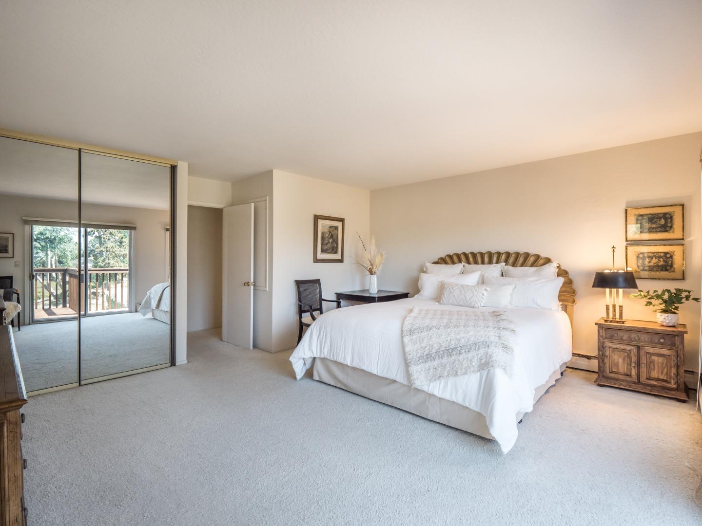 210 Greenbrier Drive Aptos, CA 95003 - Photo 28 of 63 a spacious bedroom with a bed couch and a window