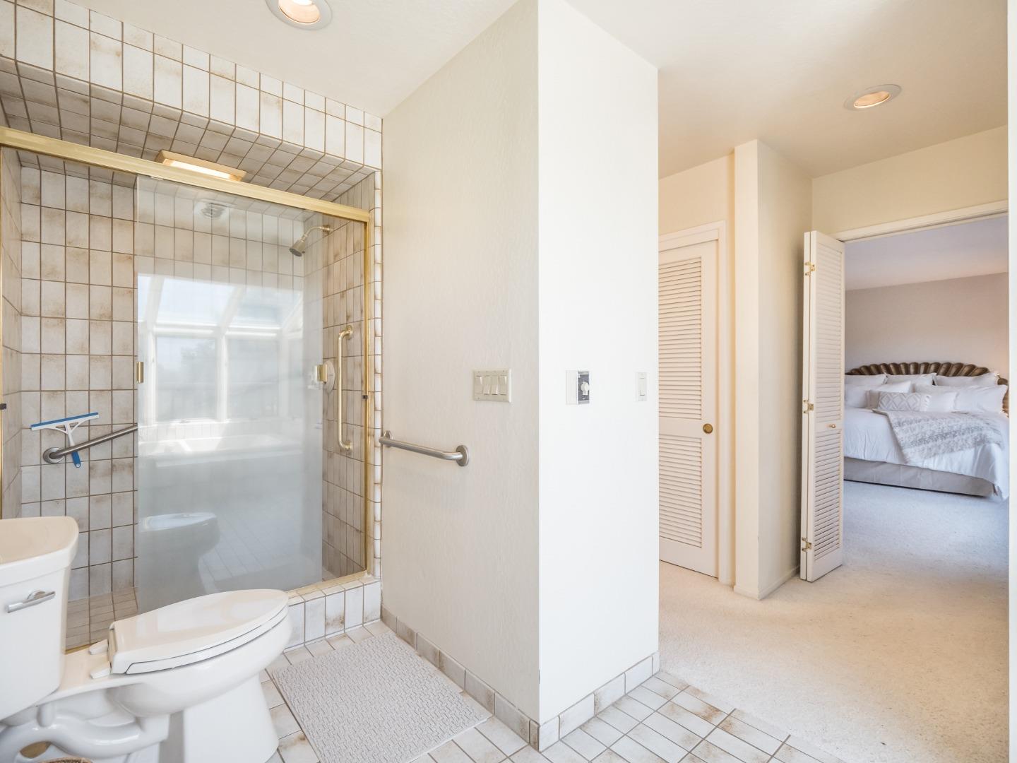 210 Greenbrier Drive Aptos, CA 95003 - Photo 31 of 63 a bathroom with a granite countertop sink mirror and a toilet