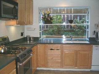 80 El Pavo Real Circle San Rafael, CA 94903 - Photo 2 of 11 a kitchen with stainless steel appliances granite countertop a sink and a stove