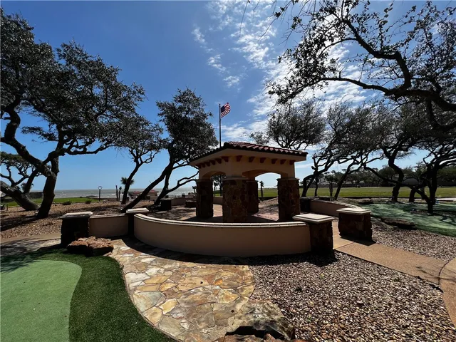 a view of a couches in the patio with a fire pit and a fire pit