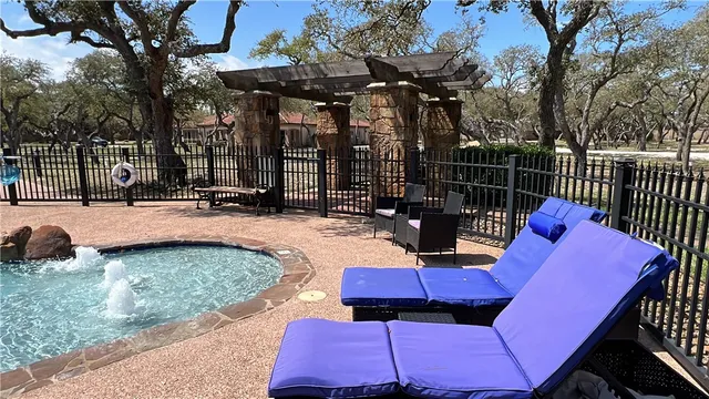 a view of backyard with seating area and trees