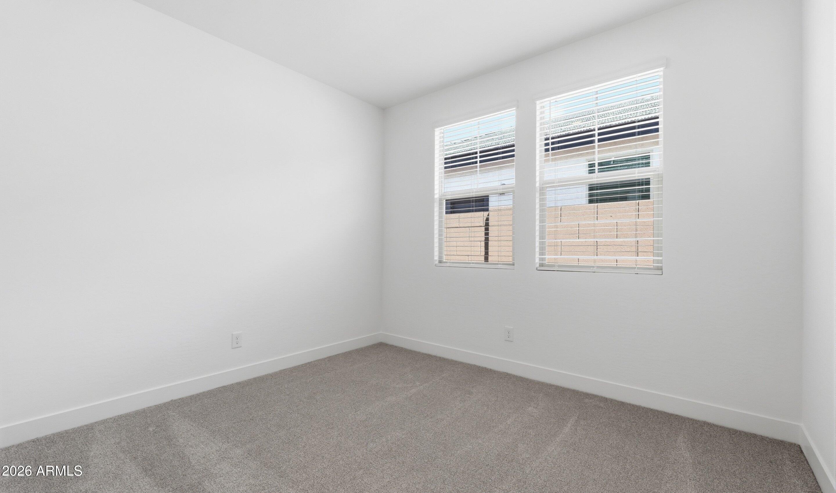 7779 West Sands Road Glendale, AZ 85303 - Photo 21 of 37 a view of empty room with windows