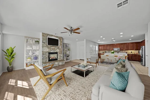 a living room with furniture and a fireplace