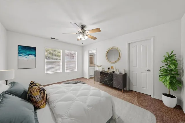 a bed room with a bed and a chandelier