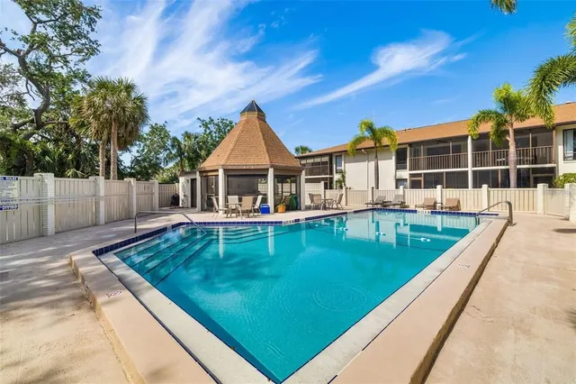 a bathroom with a double vanity sink and a window