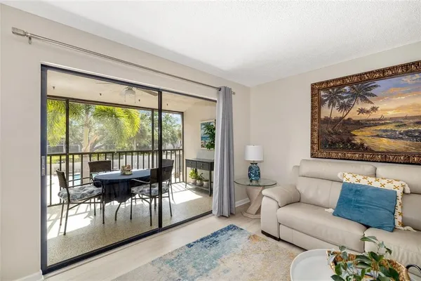 a living room with furniture and a large window