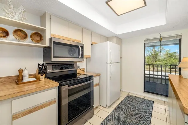 a kitchen with a stove and a refrigerator