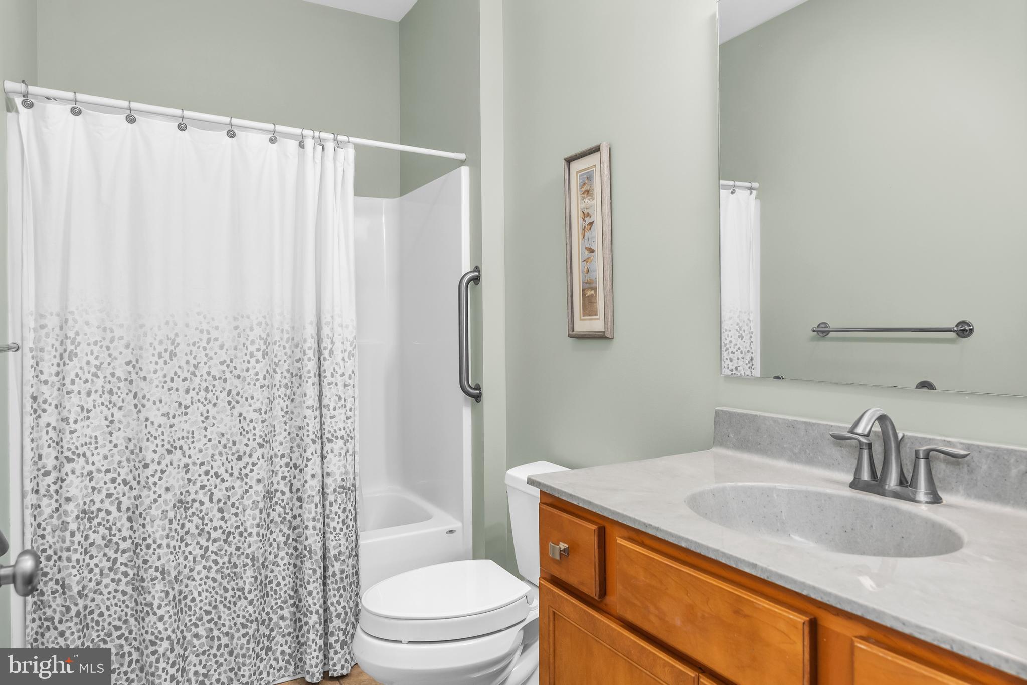5440 Anchor Road Tilghman, MD 21671 - Photo 19 of 32 a bathroom with a granite countertop sink toilet and shower