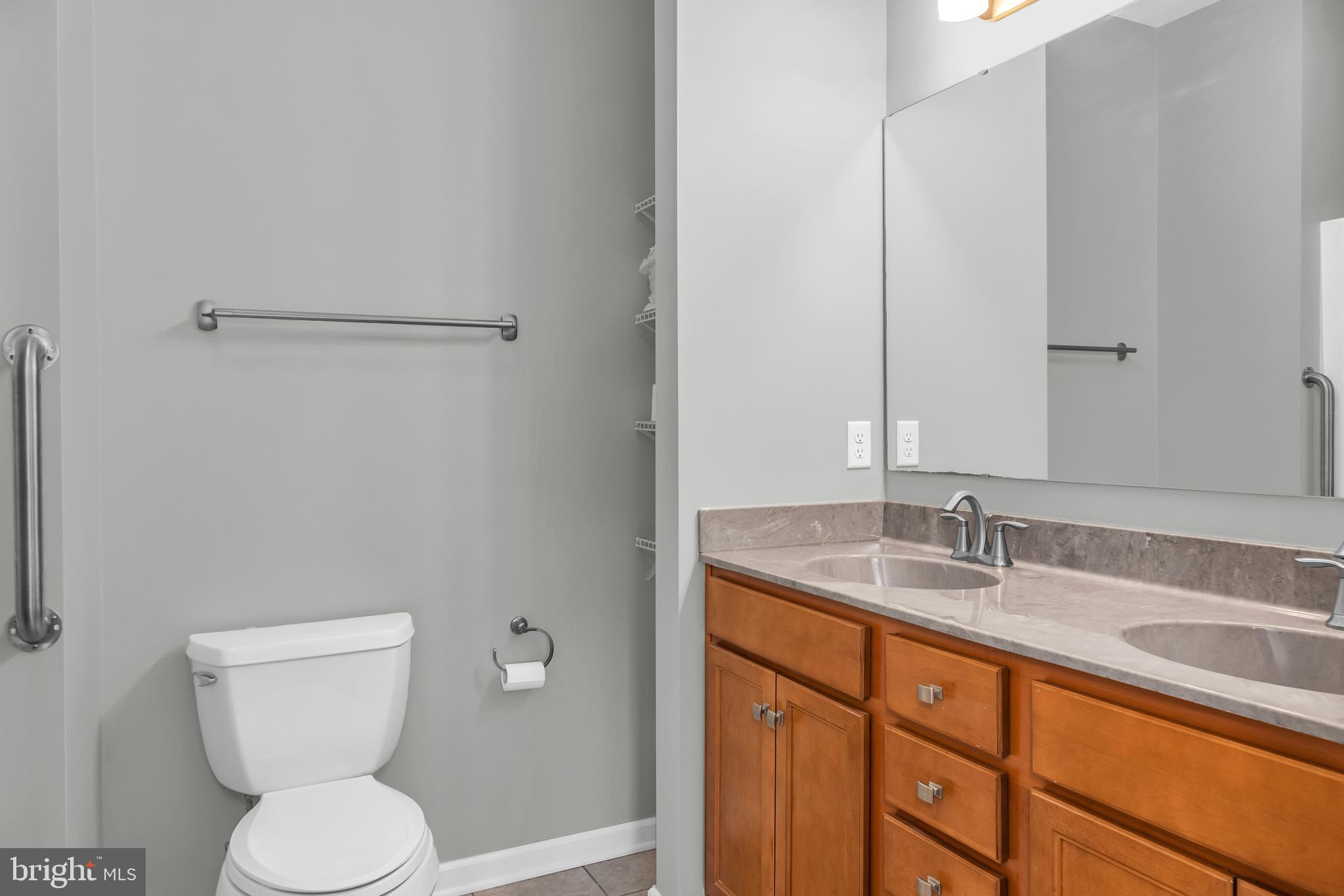 5440 Anchor Road Tilghman, MD 21671 - Photo 20 of 32 a bathroom with a toilet sink and mirror