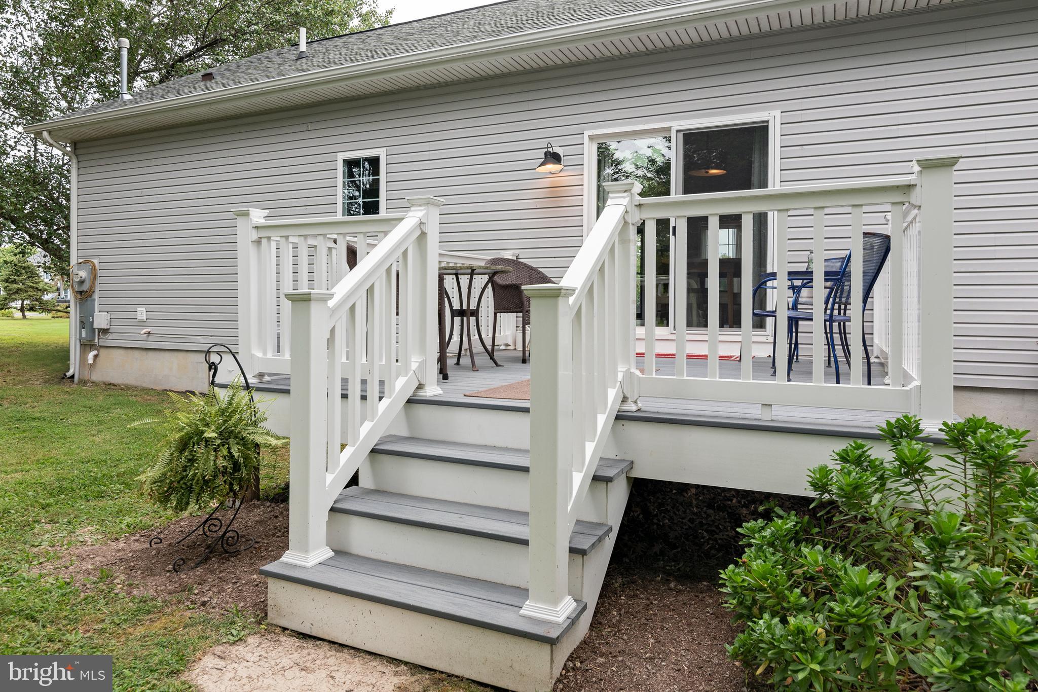 5440 Anchor Road Tilghman, MD 21671 - Photo 25 of 32 a view of a house with backyard and wooden fence