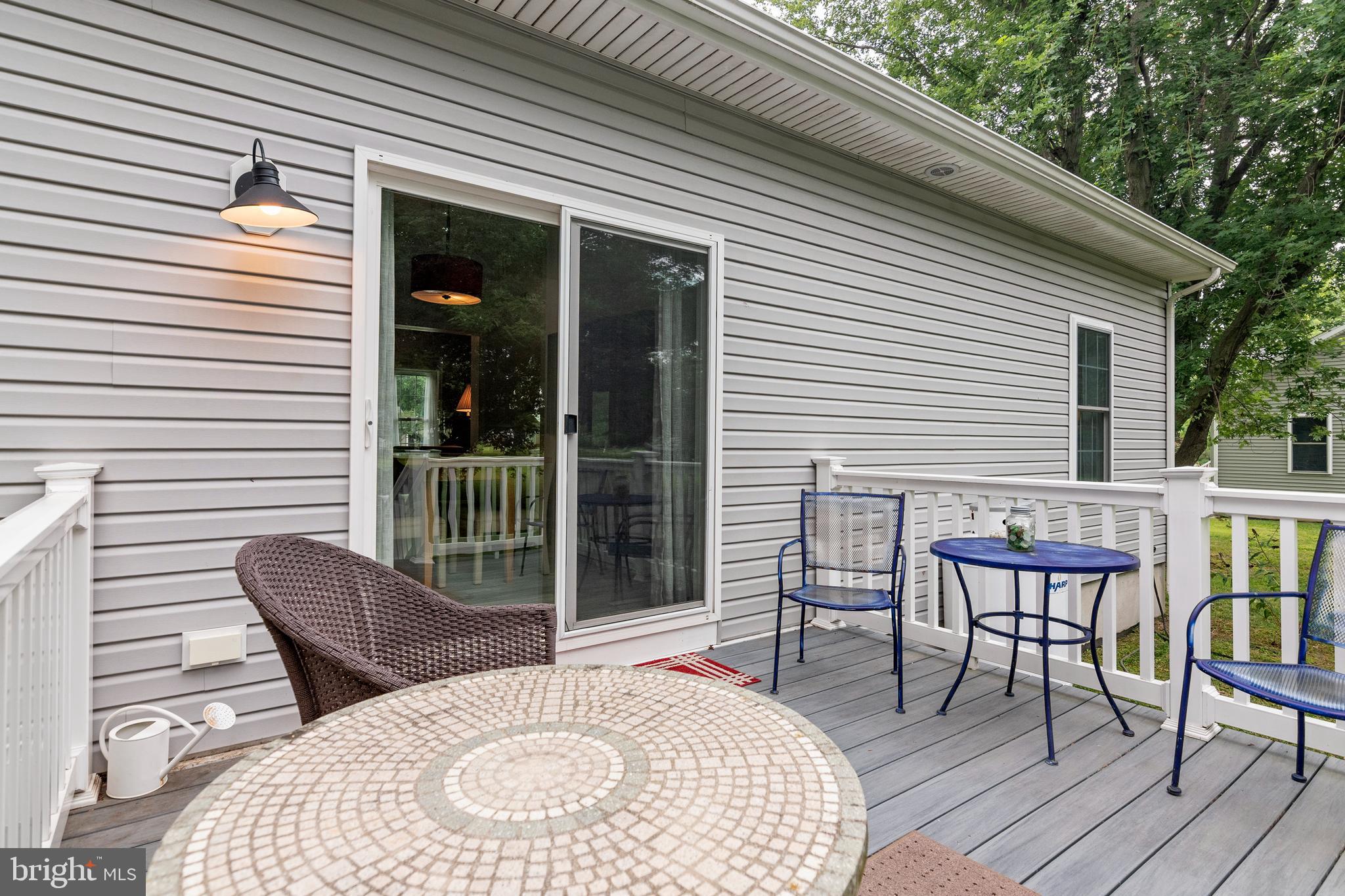5440 Anchor Road Tilghman, MD 21671 - Photo 28 of 32 a balcony with furniture and a potted plant