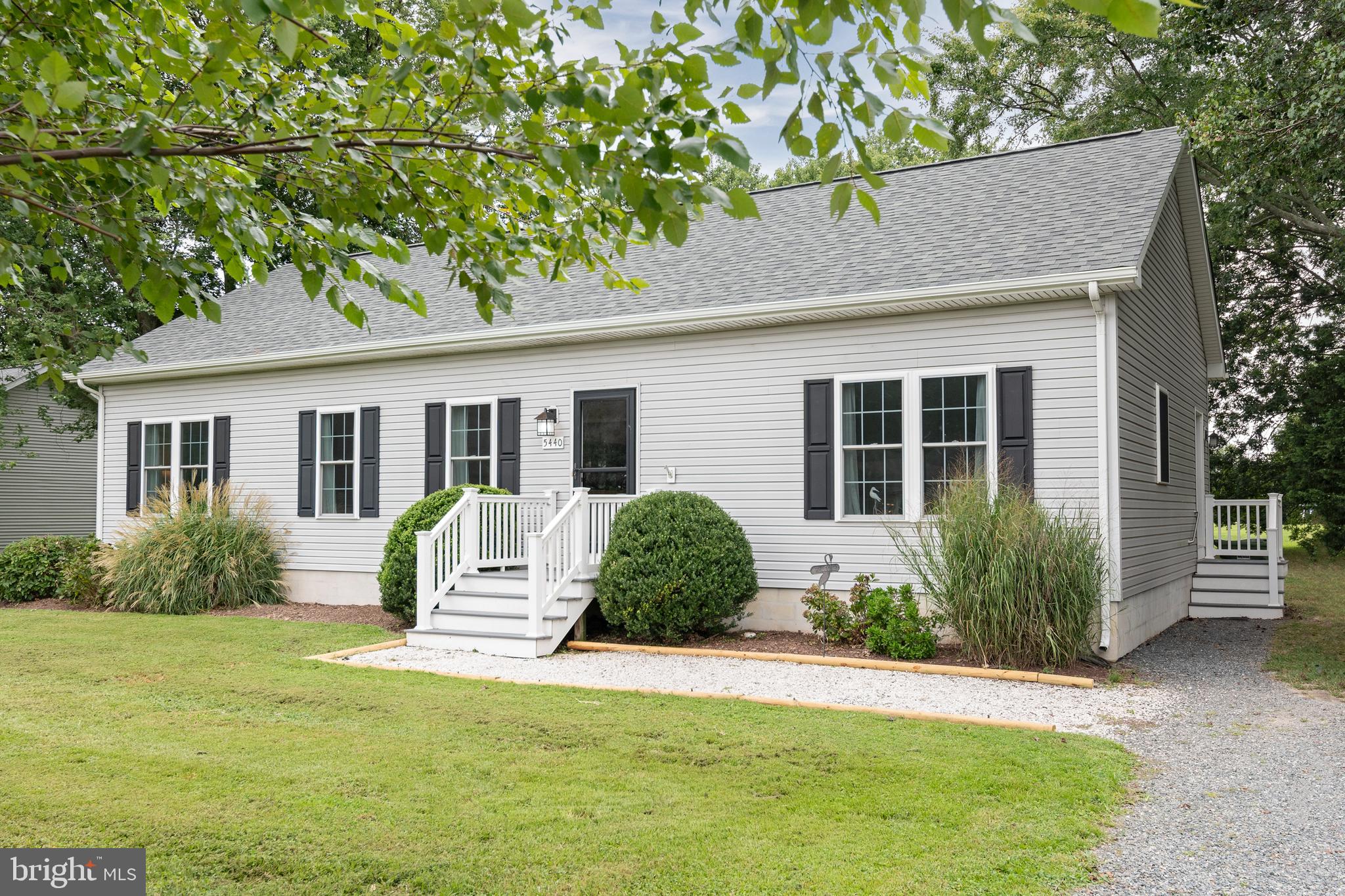 5440 Anchor Road Tilghman, MD 21671 - Photo 8 of 32 a house view with a garden space