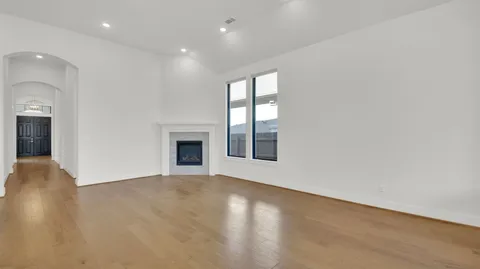 a view of kitchen with kitchen island a sink stainless steel appliances and cabinets