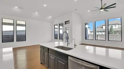 a kitchen with stainless steel appliances a cabinets and a stove top oven