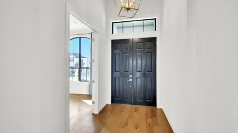 a bathroom with a double vanity sink and mirror