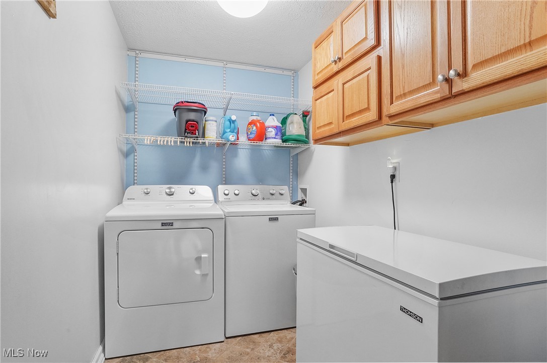 11215 Bloom Road Garrettsville, OH 44231 - Photo 11 of 42 Convenient laundry area on main floor, with cabinet space and independent washer and dryer