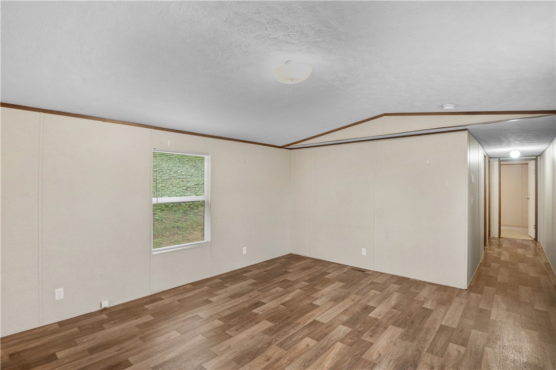 1188 Old Liberty Road Easley, SC 29640 - Photo 11 of 28 This bright room features a window offering views of the outdoors and durable flooring.