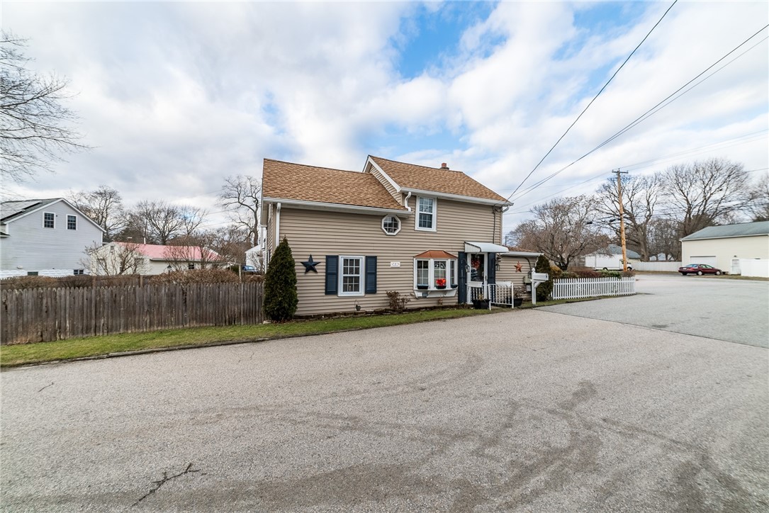 Fenced corner lot with sprinklers