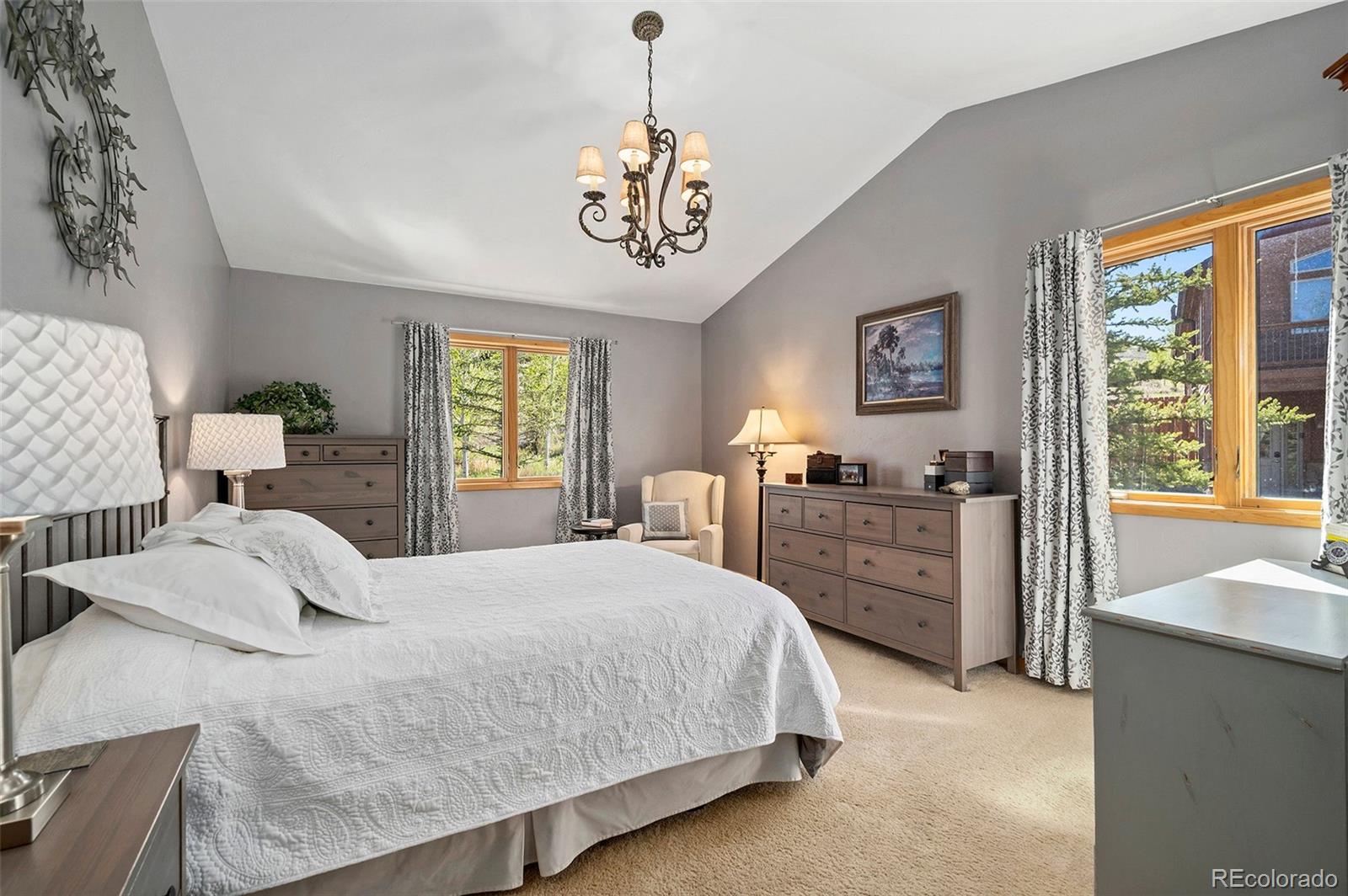 290 Village Road Granby, CO 80446 - Photo 16 of 45 a bedroom with a large bed and a window