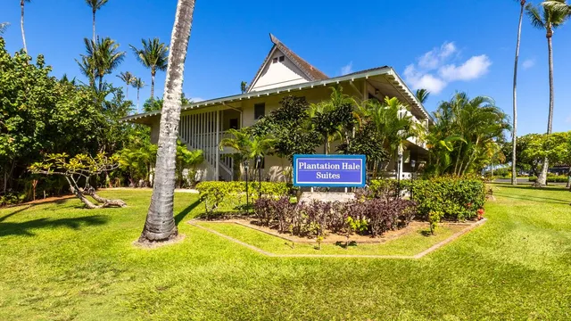 a view of a house with swimming pool and sitting space