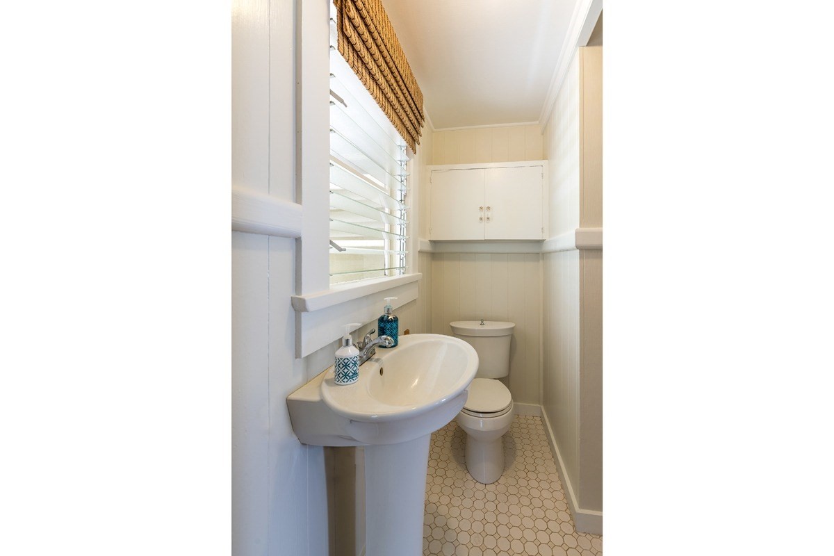 4472 A Panako Road Waimea, HI 96796 - Photo 13 of 25 a bathroom with a sink toilet and mirror