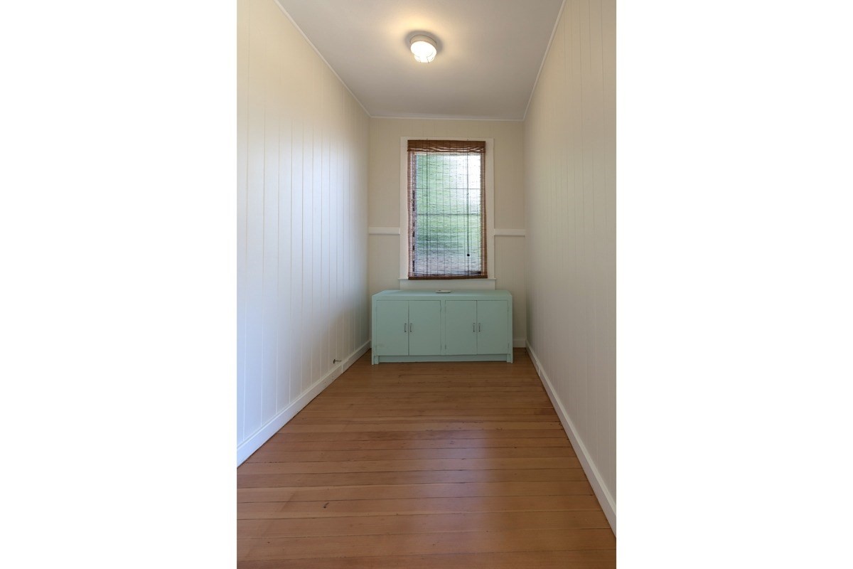 4472 A Panako Road Waimea, HI 96796 - Photo 16 of 25 a view of a hallway with wooden floor and a bathroom