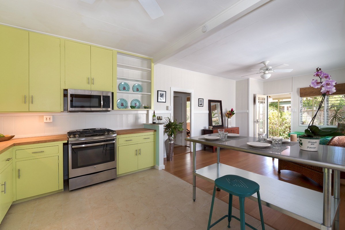 4472 A Panako Road Waimea, HI 96796 - Photo 5 of 25 a kitchen with a stove a sink and a refrigerator