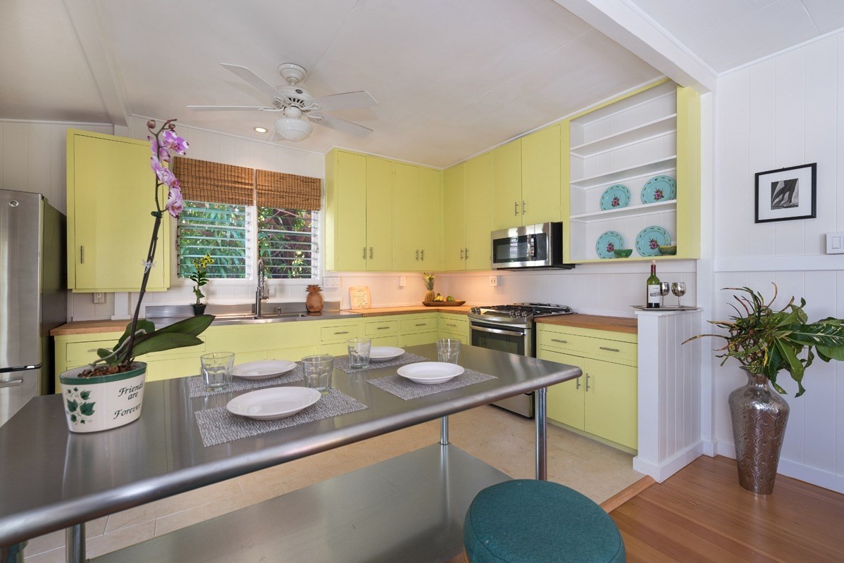 4472 A Panako Road Waimea, HI 96796 - Photo 6 of 25 a view of a dining room with furniture a potted plant and wooden floor
