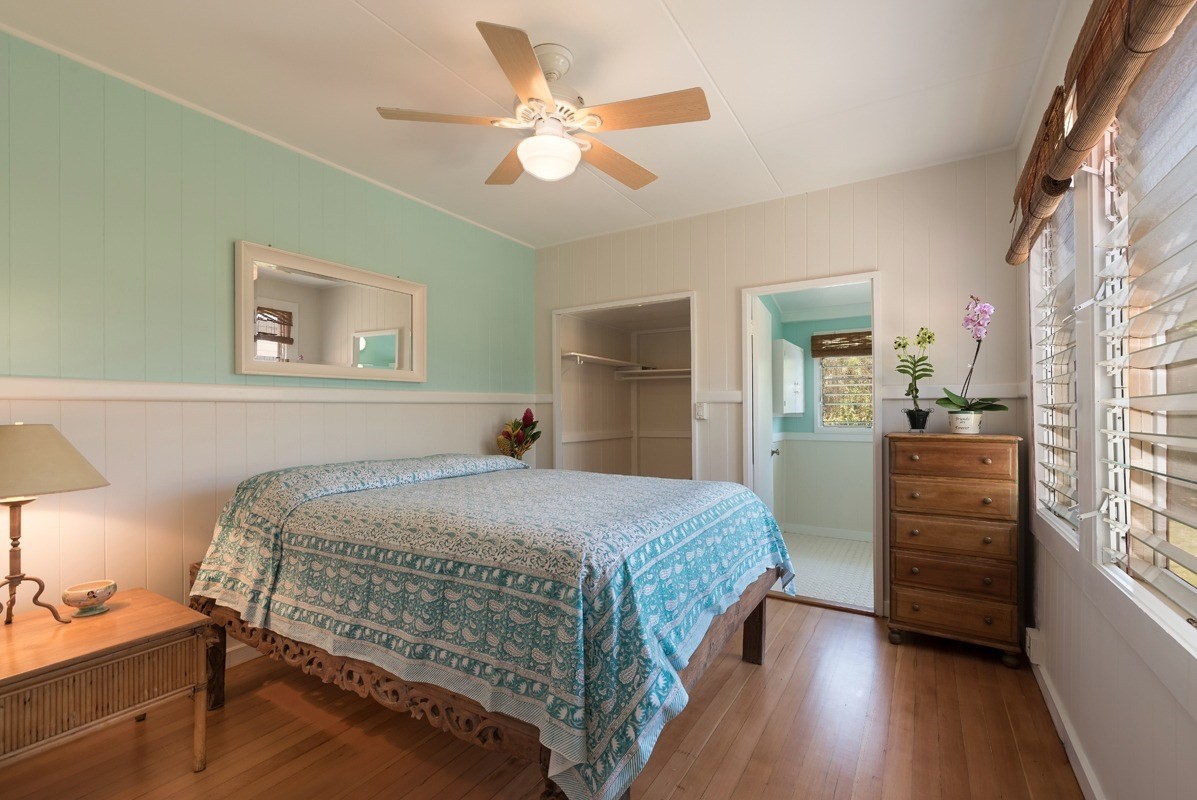 4472 A Panako Road Waimea, HI 96796 - Photo 9 of 25 a bedroom with a bed and a chandelier