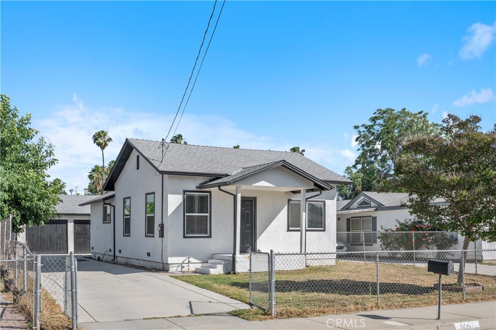 7628 Freda Avenue Riverside, CA 92504 - Photo 1 of 3 a front view of a house with garden