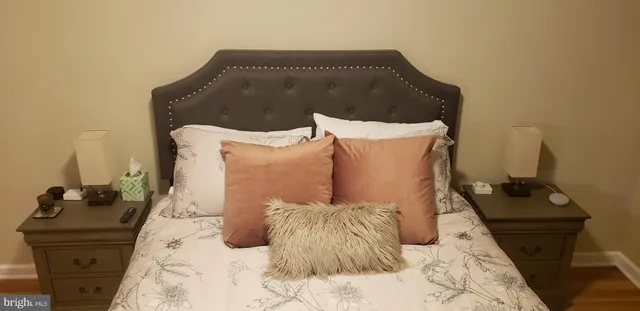 a bathroom with a white tub and shower