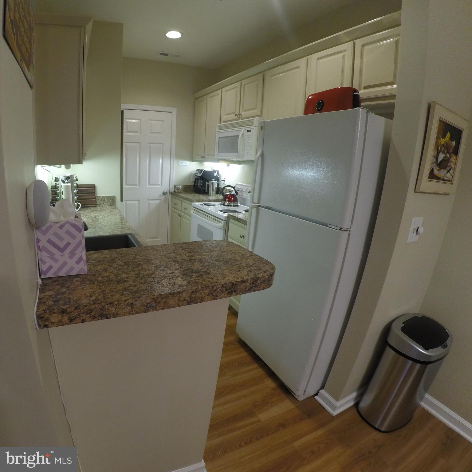 400 Cascade Lane, Unit 405 Rehoboth Beach, DE 19971 - Photo 4 of 24 Fully Stocked Kitchen