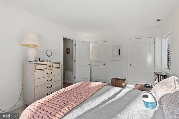 a bed room with a bed and a lamp