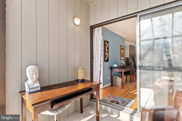 a balcony with table and chairs